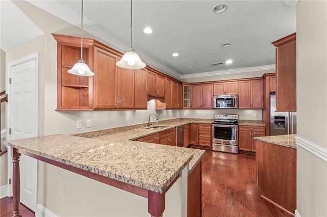 kitchen with sink, dark hardwood / wood-style flooring, kitchen peninsula, pendant lighting, and appliances with stainless steel finishes