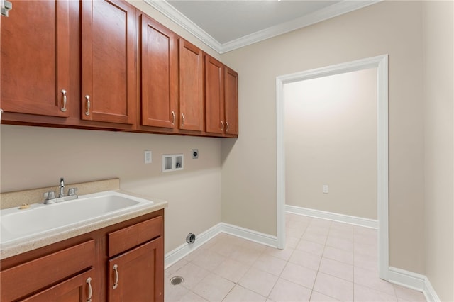 laundry area featuring cabinets, sink, crown molding, washer hookup, and hookup for an electric dryer