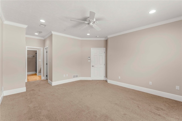 empty room with light carpet, ceiling fan, and ornamental molding