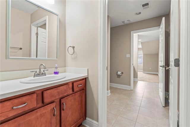 bathroom featuring tile patterned flooring and vanity