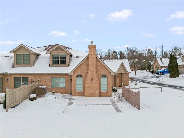 view of snow covered house