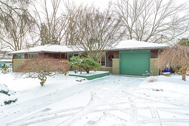 single story home with a garage