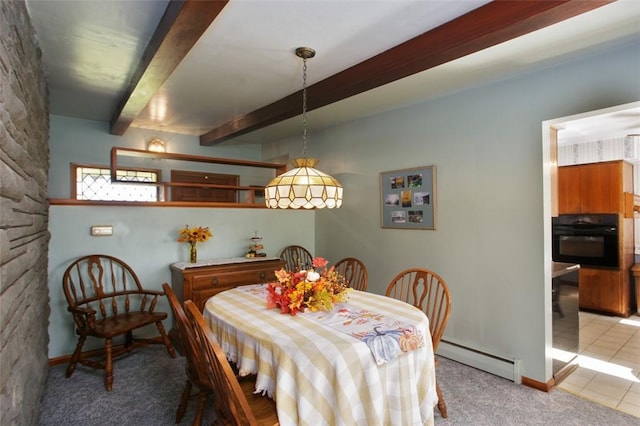 carpeted dining room featuring beam ceiling and a baseboard heating unit