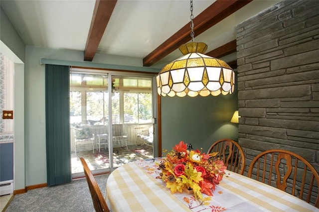 dining area featuring beamed ceiling and a baseboard heating unit