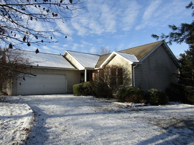 single story home with a garage