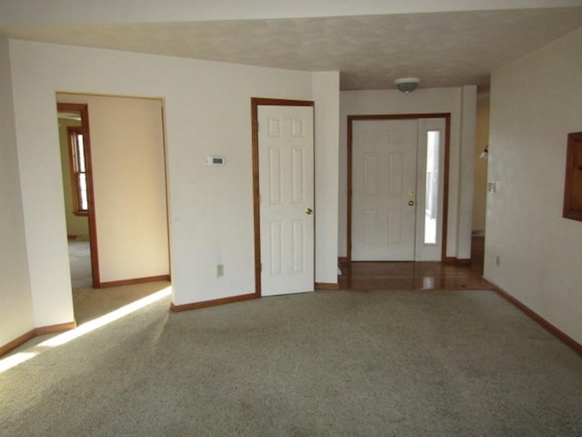 view of carpeted entrance foyer