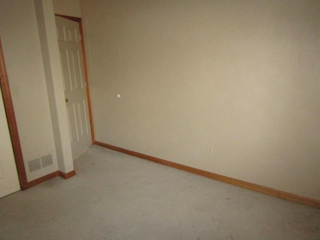 unfurnished bedroom featuring light colored carpet