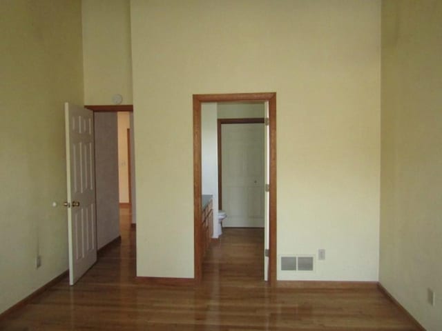 spare room with wood-type flooring