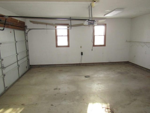 garage featuring a garage door opener