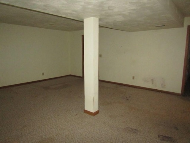 basement featuring carpet flooring