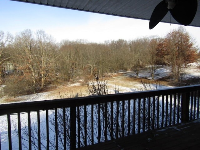 wooden terrace featuring ceiling fan