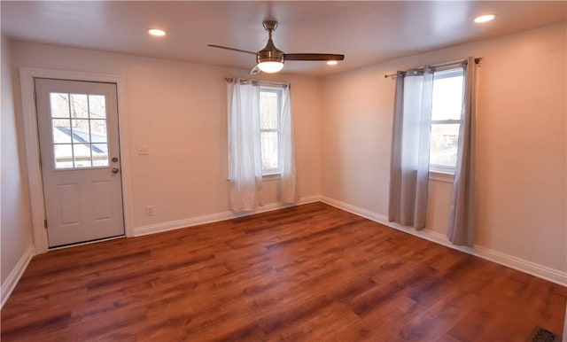 interior space with ceiling fan and dark wood-type flooring