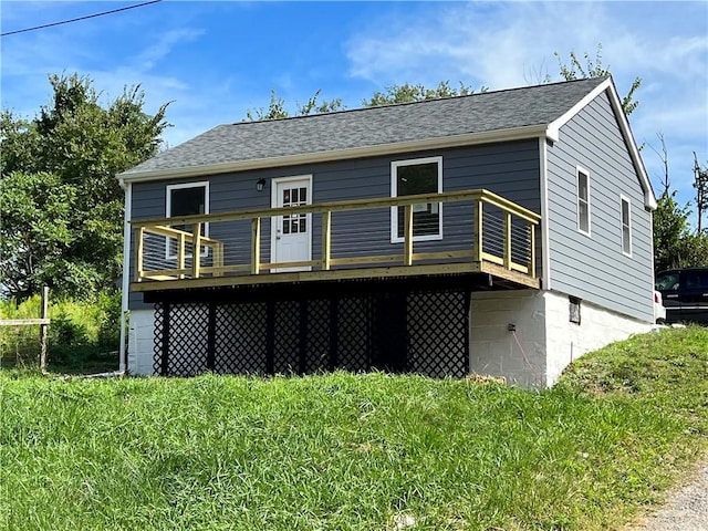 back of house featuring a wooden deck