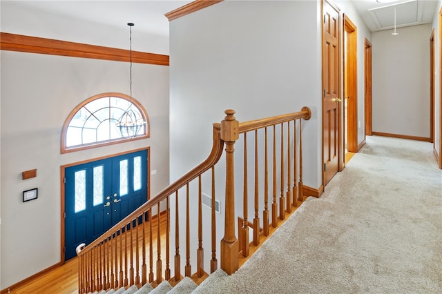 foyer entrance featuring light colored carpet