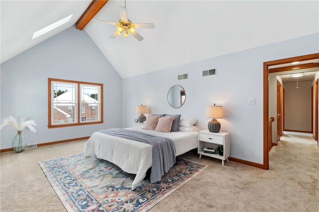 bedroom with ceiling fan, lofted ceiling with beams, and carpet floors