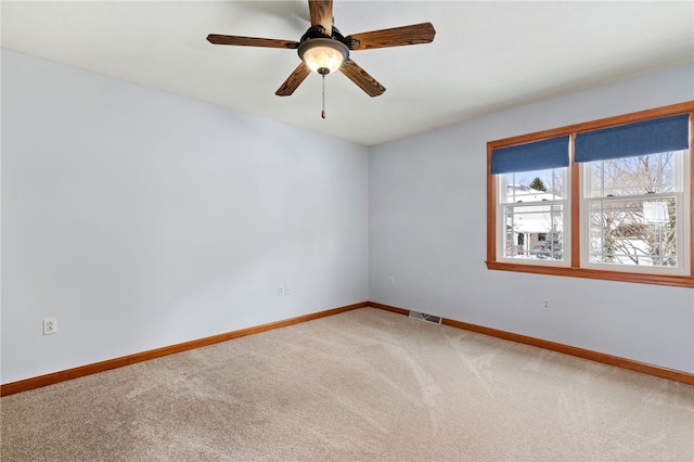 unfurnished room featuring carpet flooring and ceiling fan