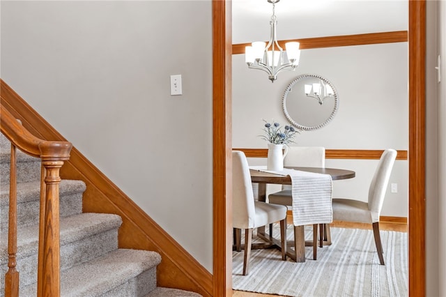 dining space with a notable chandelier