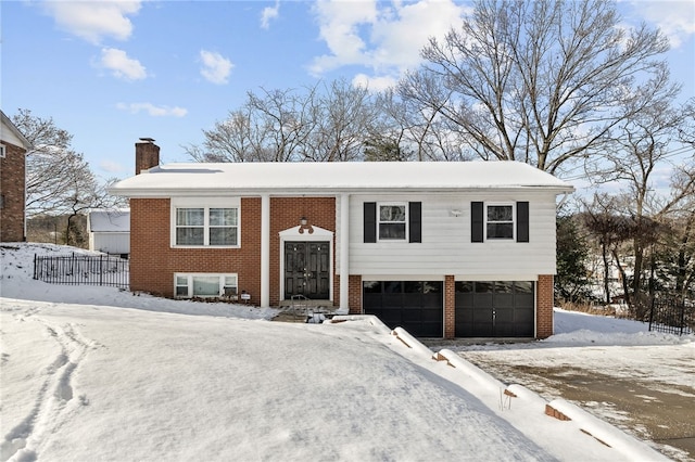 bi-level home featuring a garage