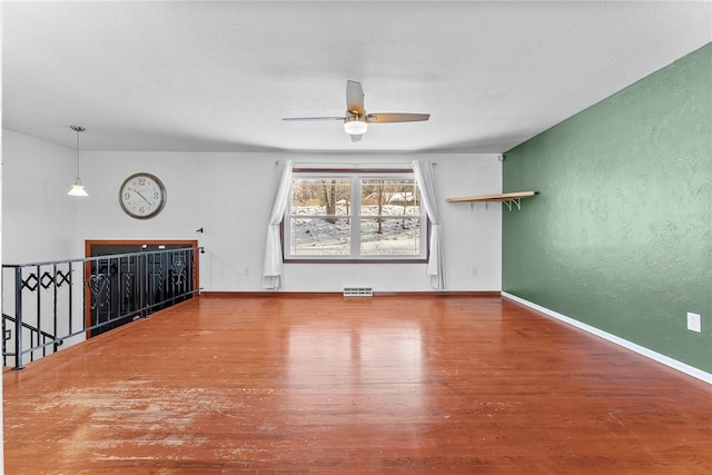 unfurnished room featuring hardwood / wood-style flooring and ceiling fan