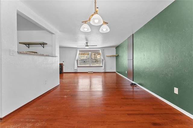 interior space with ceiling fan and hardwood / wood-style floors