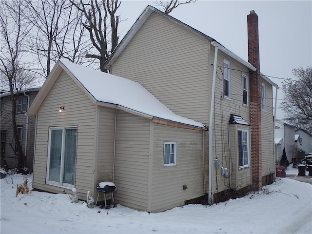 view of snow covered house