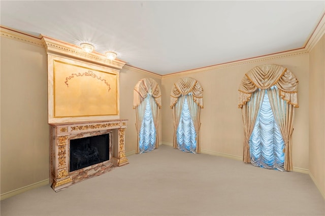 unfurnished living room with carpet flooring, a fireplace, and ornamental molding