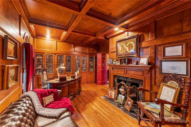 office area with beam ceiling, wooden ceiling, coffered ceiling, crown molding, and a fireplace