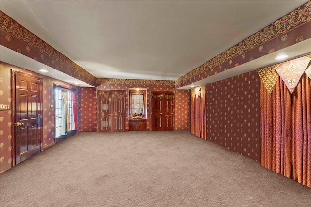 unfurnished living room with carpet flooring