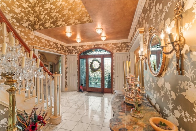 entrance foyer featuring crown molding