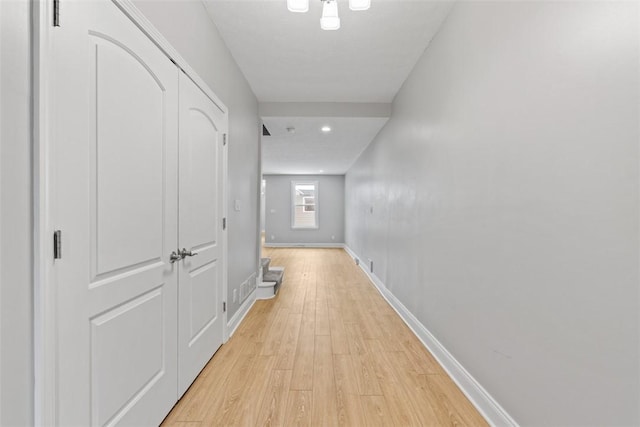 corridor featuring light hardwood / wood-style flooring