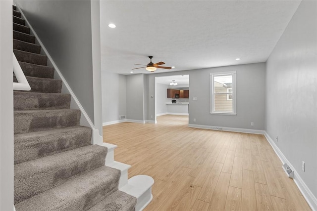 interior space featuring hardwood / wood-style flooring and ceiling fan