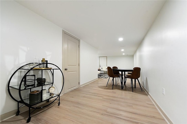 dining area with light hardwood / wood-style floors