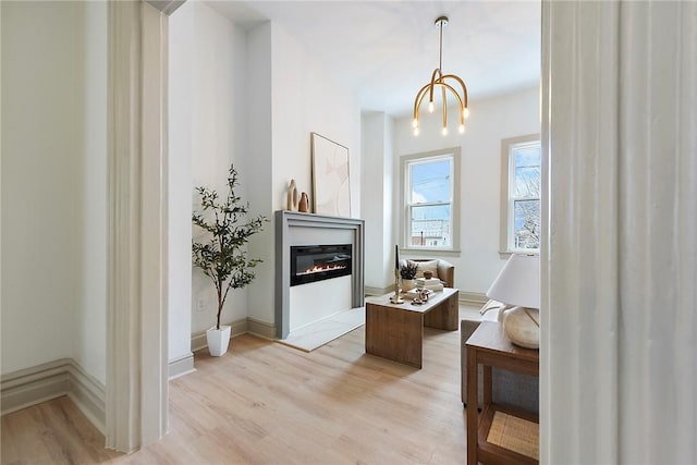 bathroom featuring hardwood / wood-style floors and a notable chandelier