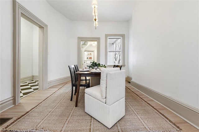 dining area featuring wood-type flooring