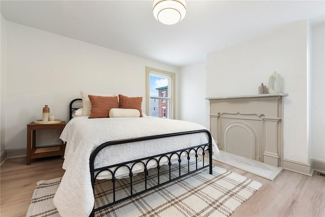 bedroom with light wood-type flooring