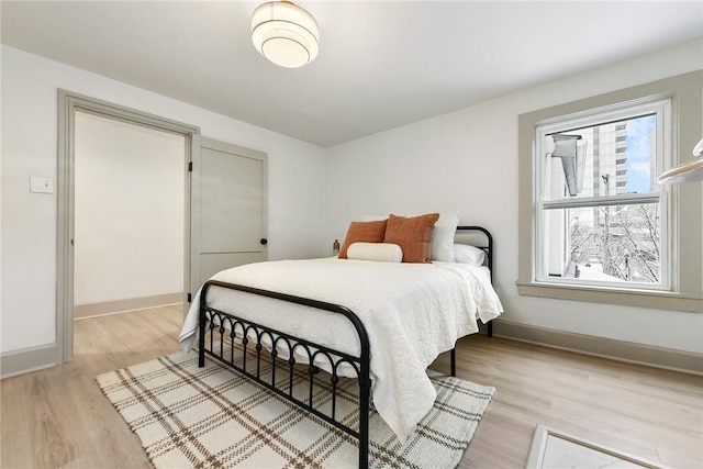 bedroom with light wood-type flooring