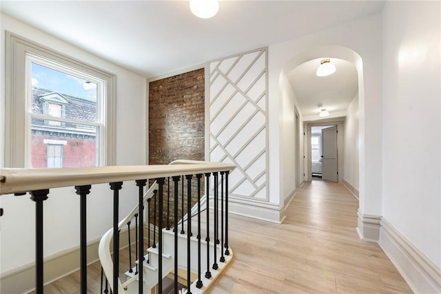 corridor with light hardwood / wood-style flooring