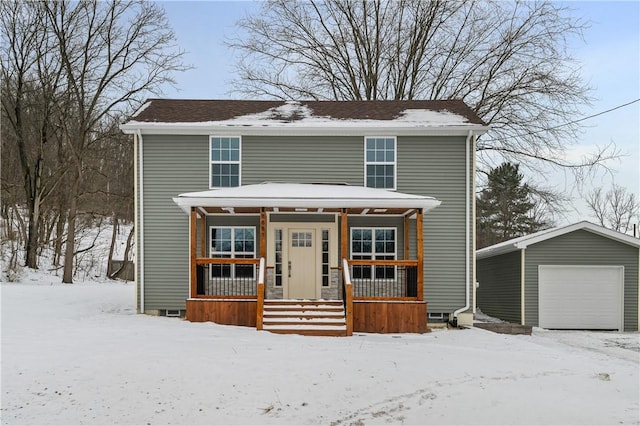 front of property with an outbuilding, covered porch, and a garage