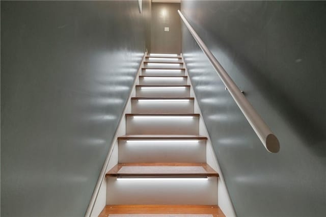 staircase featuring hardwood / wood-style floors