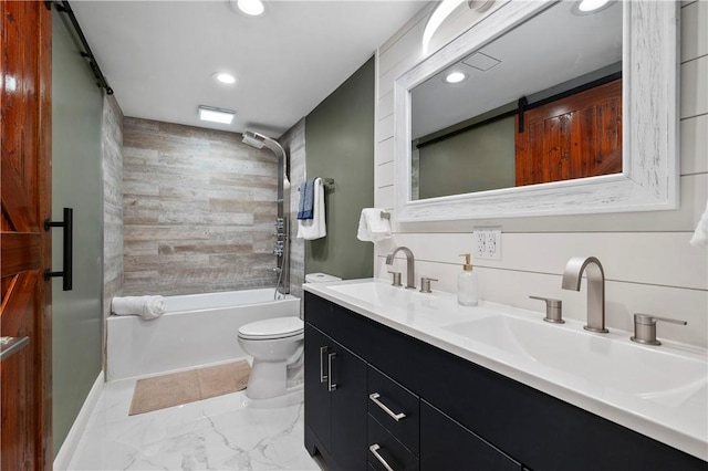 full bathroom featuring vanity, tiled shower / bath combo, and toilet