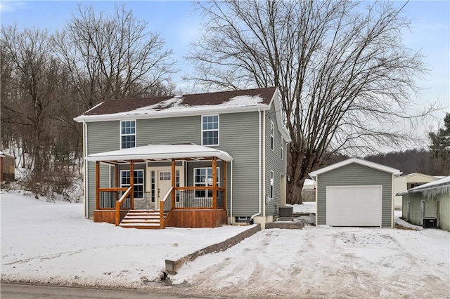 view of front property featuring an outbuilding, a porch, and a garage