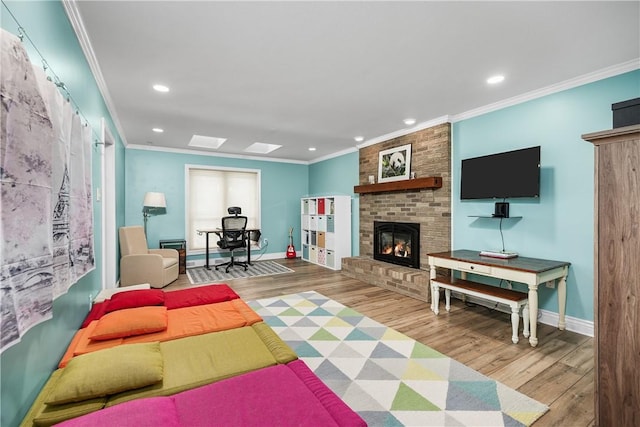 living room featuring a fireplace, light wood-type flooring, and ornamental molding