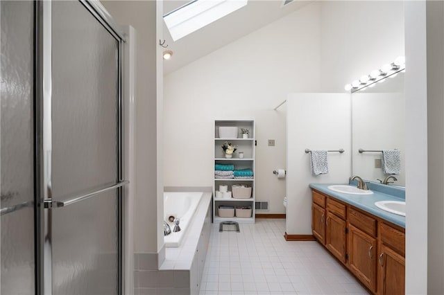 bathroom with vanity, lofted ceiling with skylight, and shower with separate bathtub