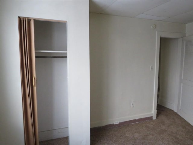 unfurnished bedroom with carpet floors