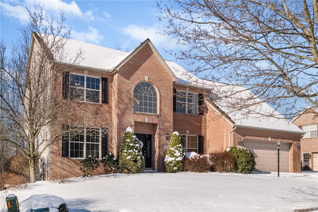 colonial inspired home featuring a garage