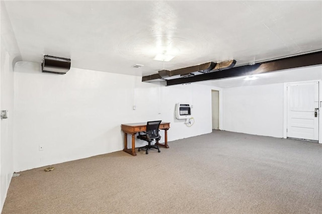 basement with carpet and heating unit