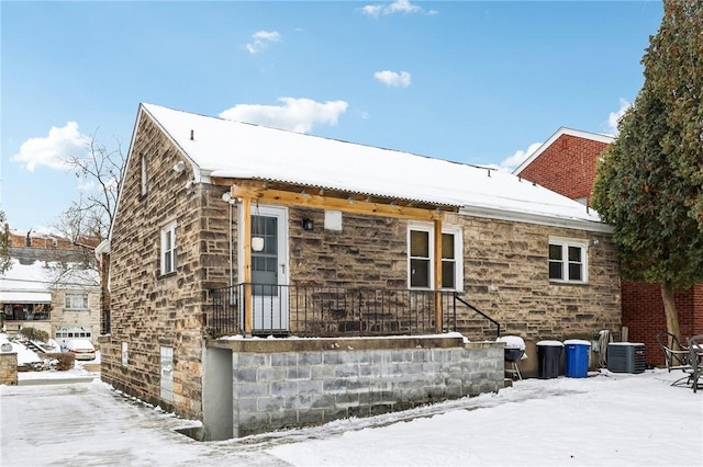 view of snow covered exterior with central air condition unit