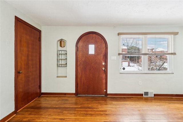 foyer entrance with hardwood / wood-style floors