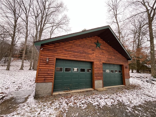 view of snow covered garage