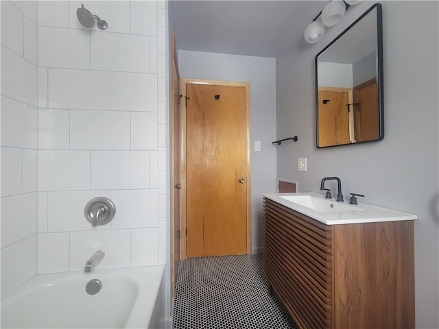 bathroom with vanity and tiled shower / bath combo